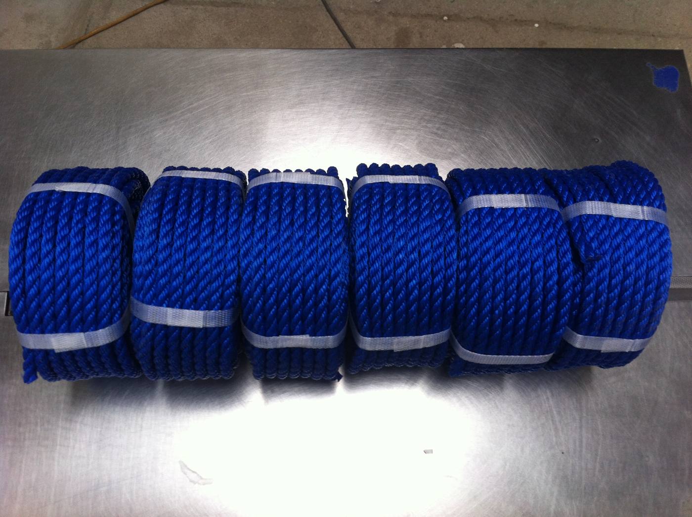 Blue PE 3-strand rope coils ready for bulk supply