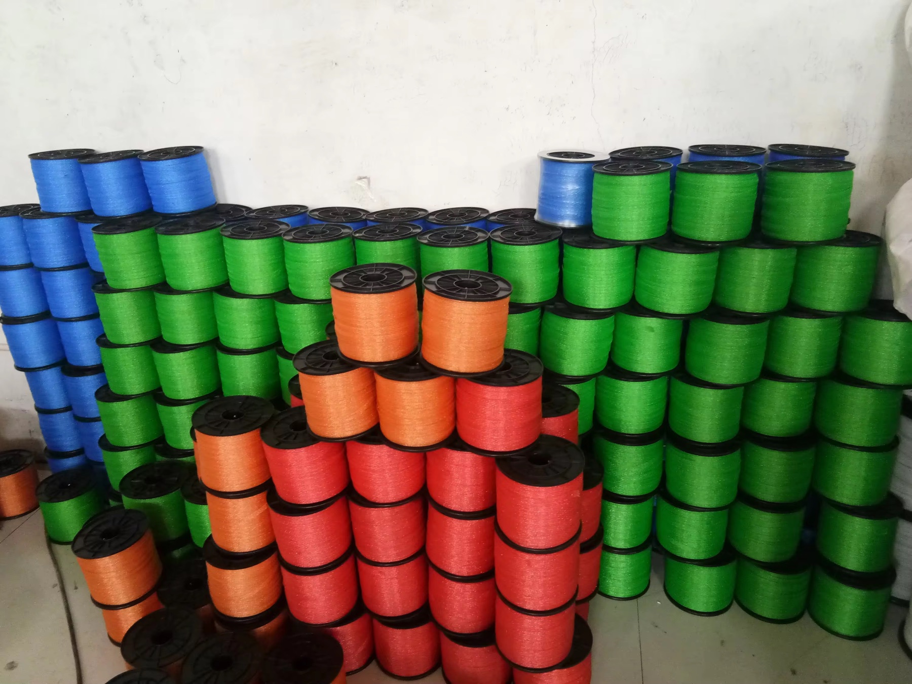 Electric fence polytape reels in green, blue, orange and red color options