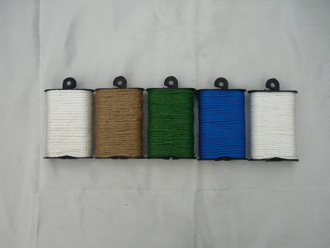 Polyethylene braided twine on small plastic spools, five colors in a row