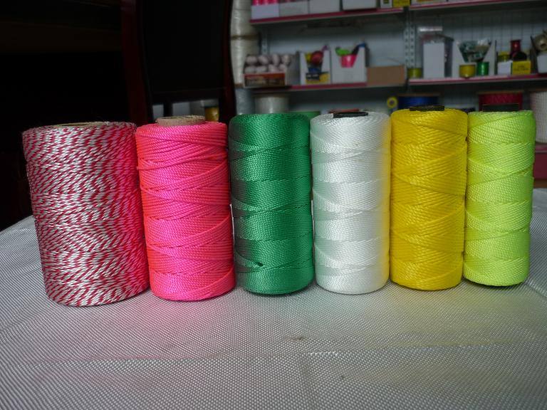 Coloured builder’s / masons’ line on small spools, in a hardware context